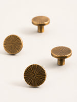 Antique brass sunray round cabinet knobs — 4 pieces