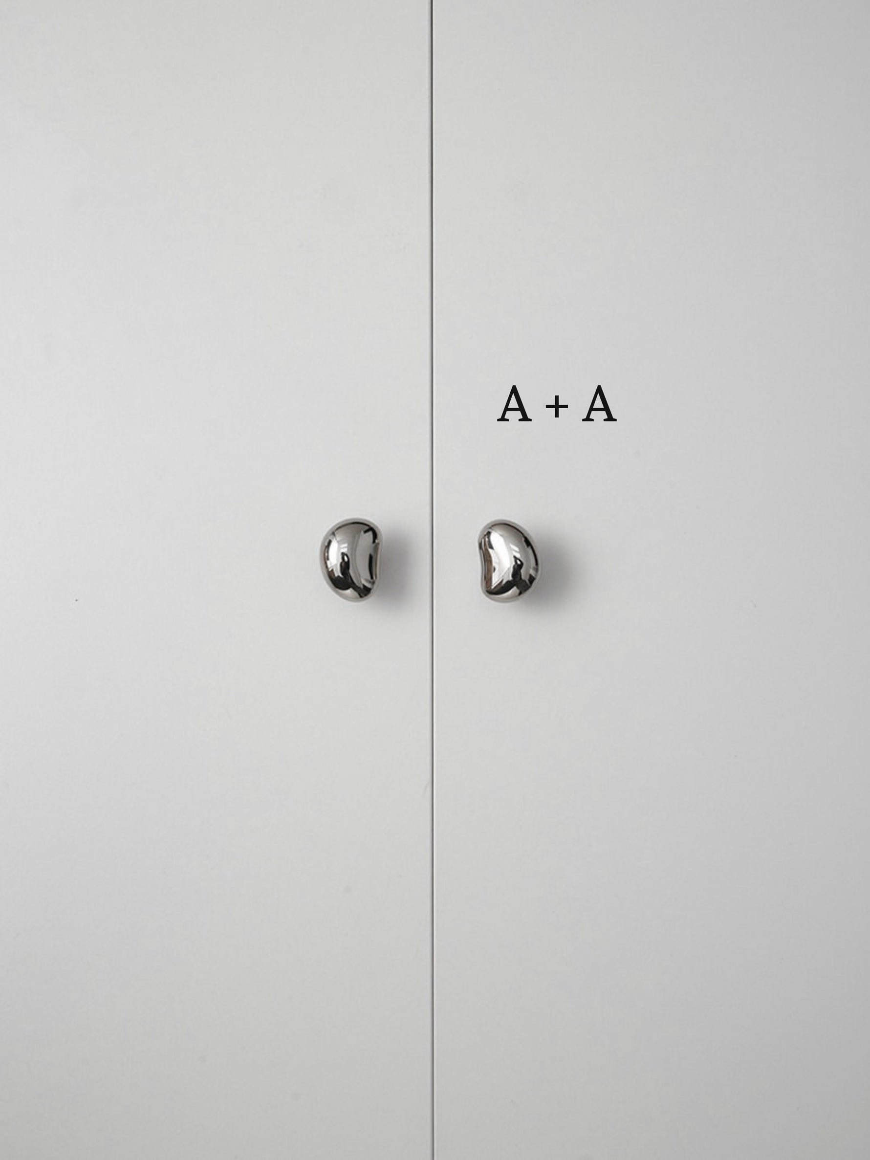 Polished chrome pebble knobs on white cabinet doors labeled size A plus A comparison