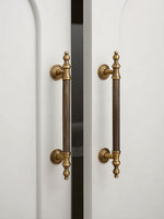 Vintage Brass Cabinet Pull Installed on White Cabinet Door