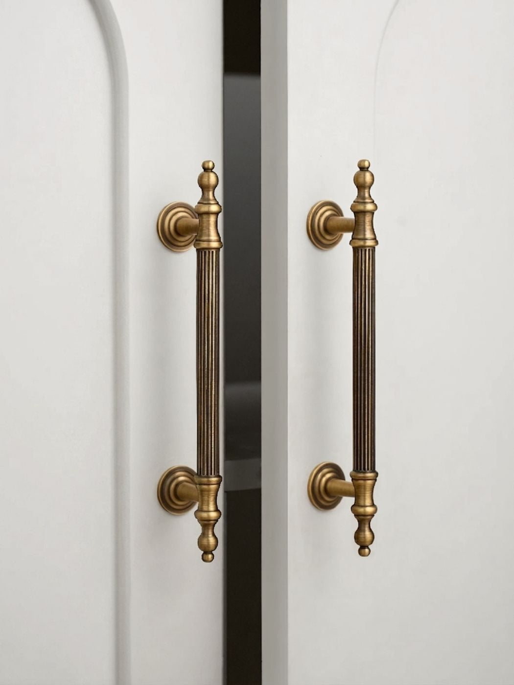 Vintage Brass Cabinet Pull Installed on White Cabinet Door
