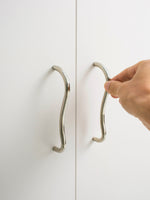 Hand opening wardrobe door using chrome wave pull