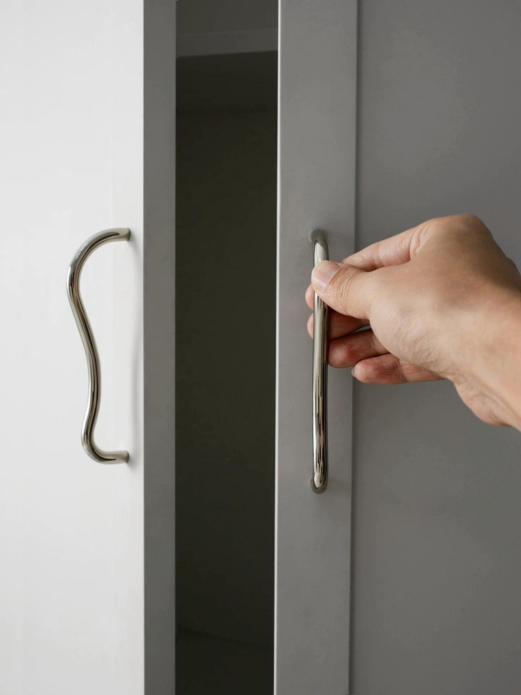 Chrome wave pull on grey sliding wardrobe door