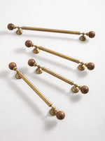 Multiple antique brass walnut ball pulls diagonal arrangement