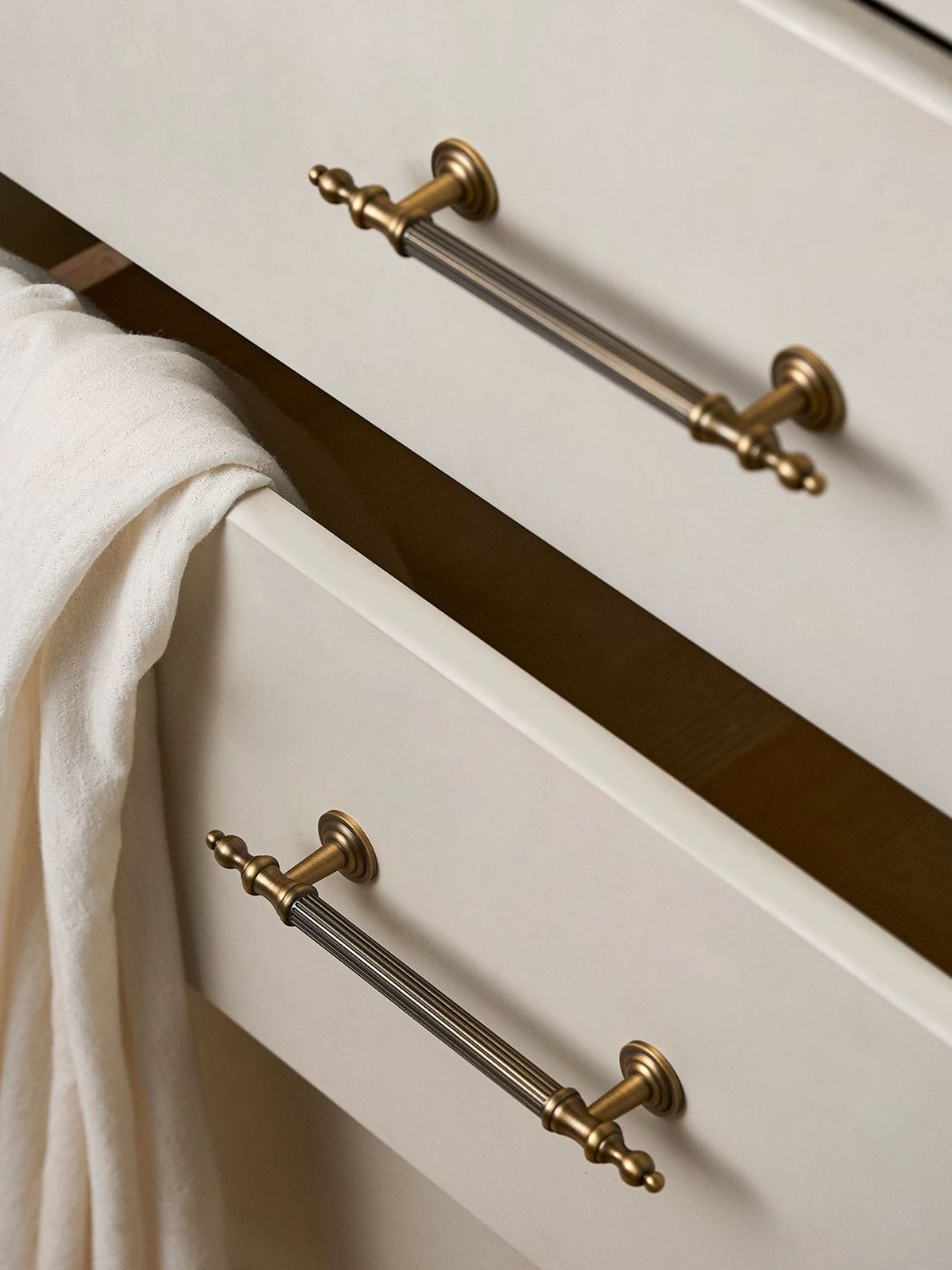 Brass Drawer Pull on White Bathroom Vanity Drawer