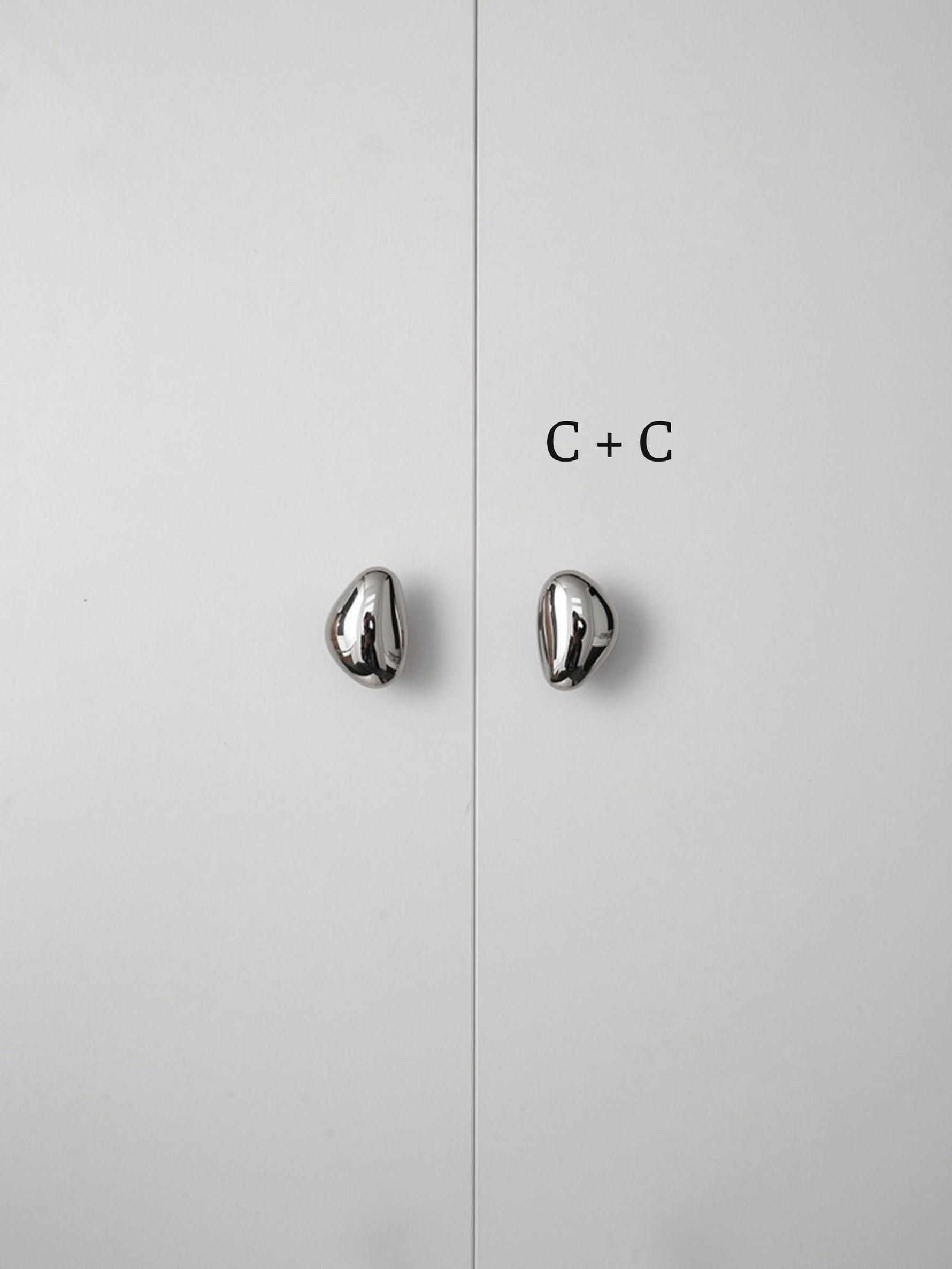 Polished chrome pebble knobs on white cabinet doors labeled size C plus C comparison