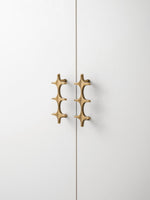 Antique Brass Star Pull Side Profile on Cabinet Door OlumeHardware