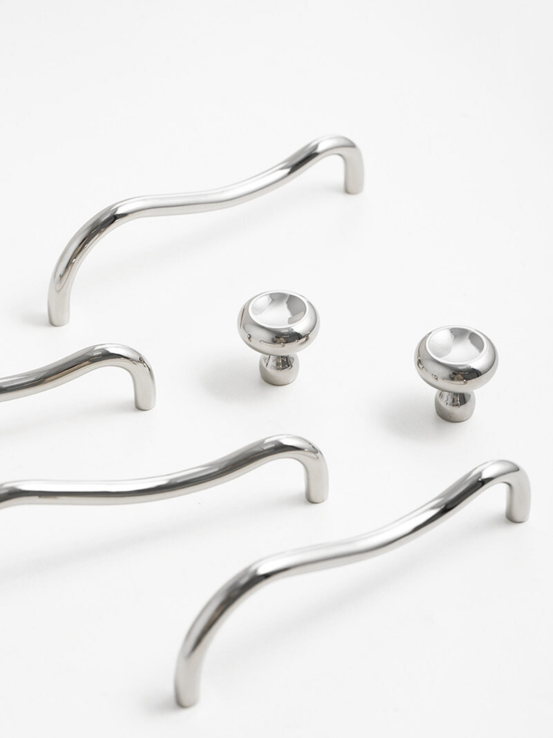 Chrome wave pulls with matching round knobs