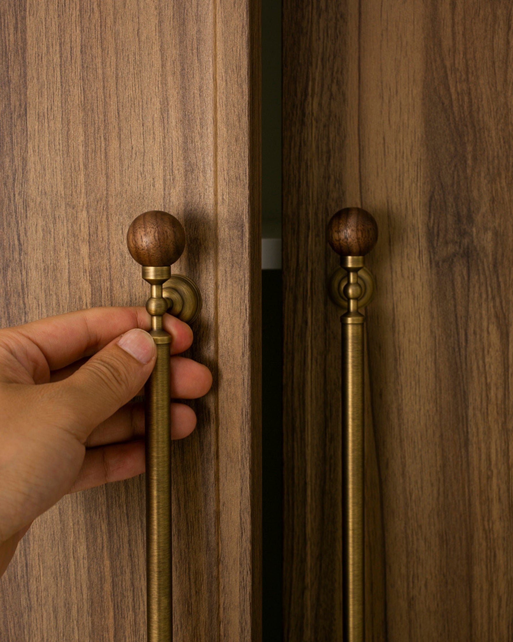 Hand opening walnut wardrobe with antique brass walnut ball pull