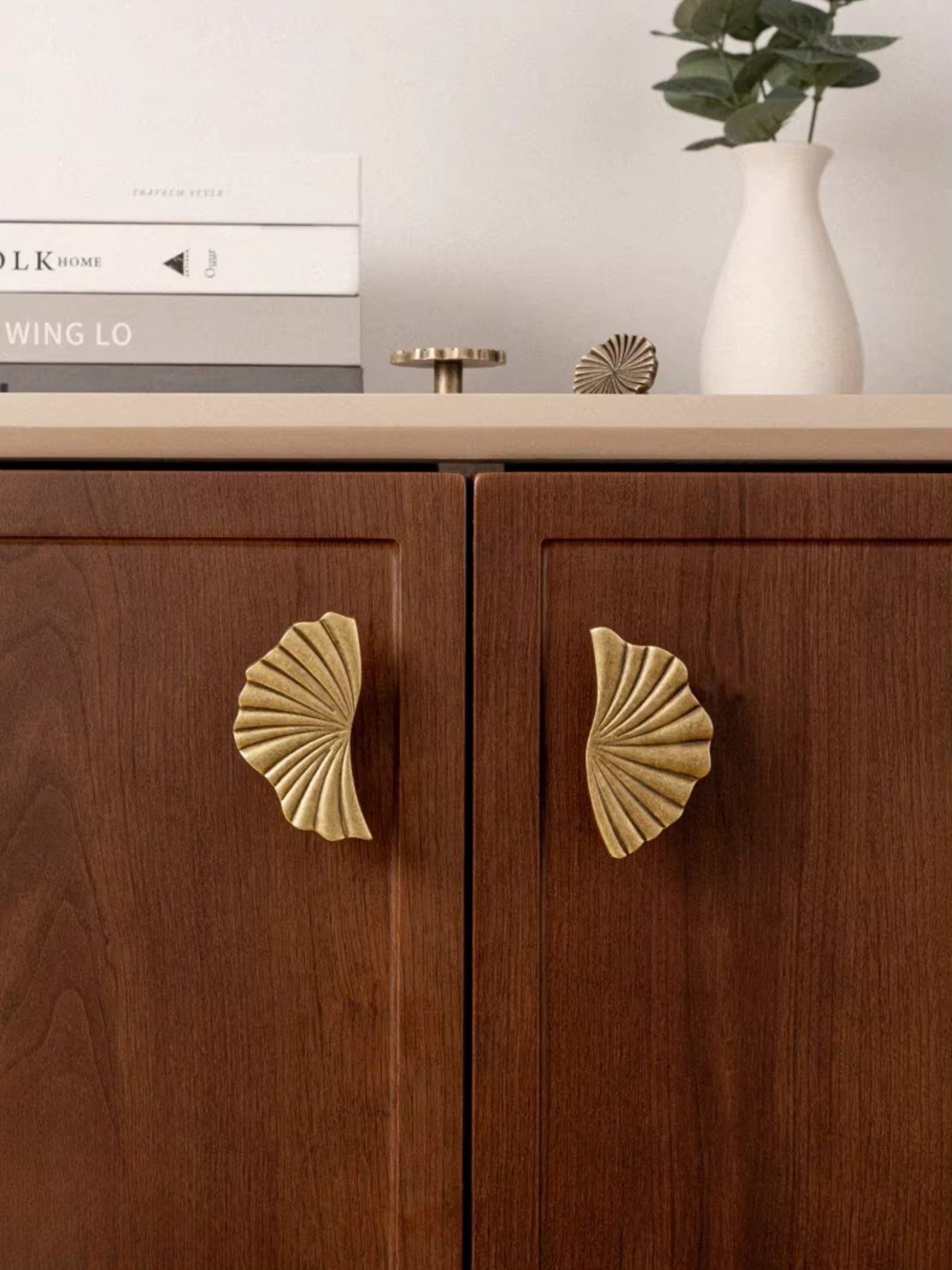 Large ginkgo fan pulls on walnut sideboard cabinet doors
