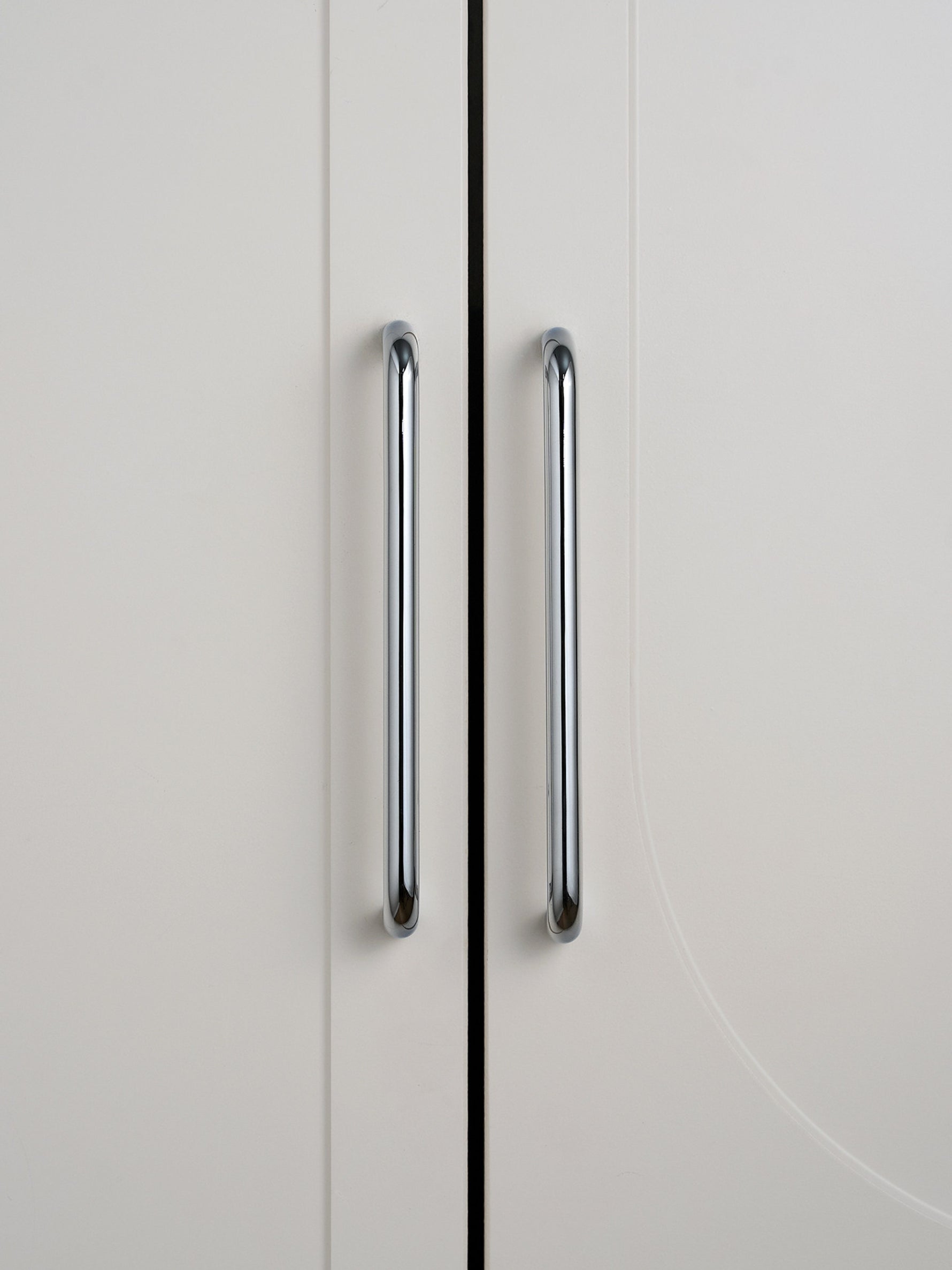 Two polished chrome bar pulls on grey cabinet doors, front view