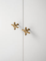 Antique Brass Star Knob Side Profile Installed Cabinet OlumeHardware