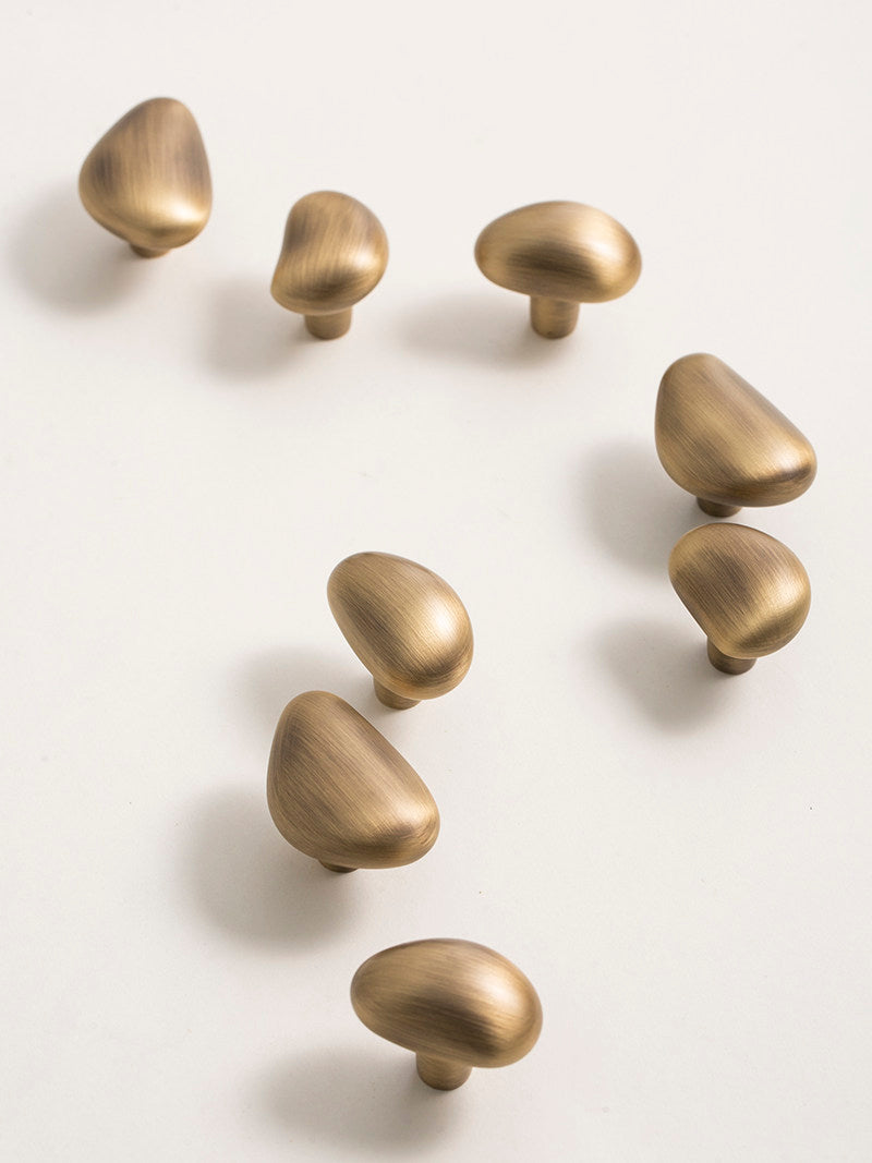 Assorted brushed brass pebble knobs organic hardware collection